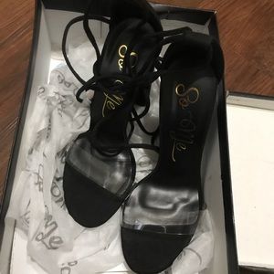Black and clear lace up shoes